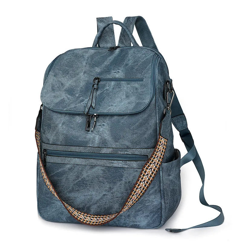 Solid colour retro college backpack with curved shoulder straps, shown in multiple colour options including black and blue.