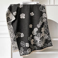 Long grey imitation cashmere winter scarf with tassels, shown draped
