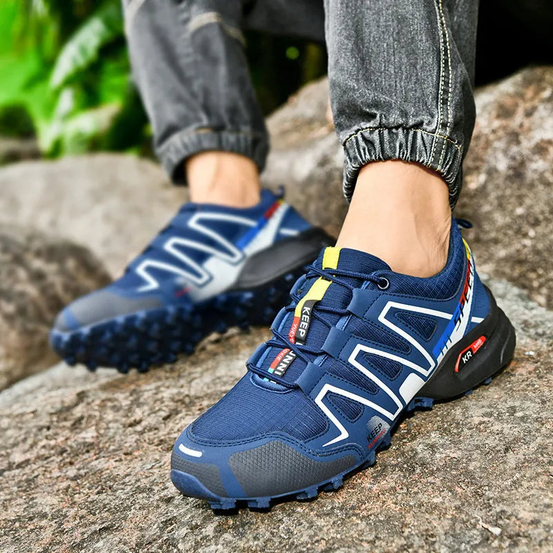 Men's gray orange casual low-top running shoes with synthetic leather upper and rubber sole.