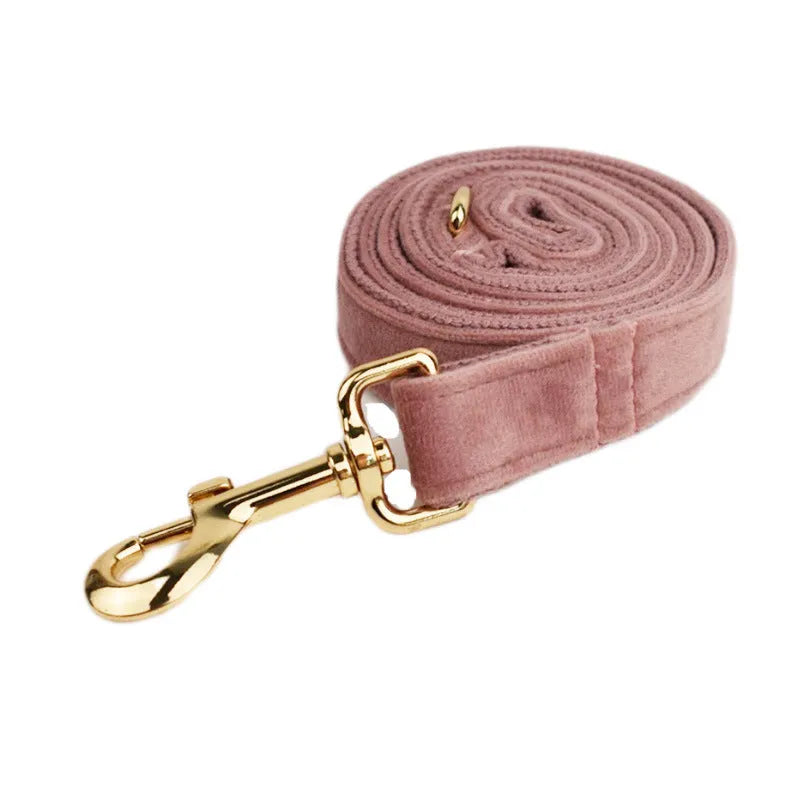 Light purple pink velvet dog collar set with leash and matching accessories on cloth material