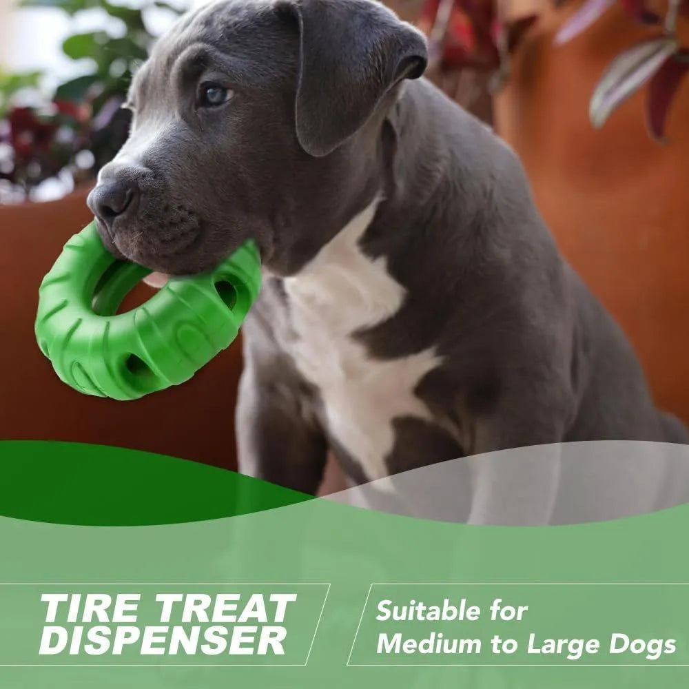 Blue, green, and red tyre-shaped dog chew toy with oval openings, a slow feeder and treat dispenser.
