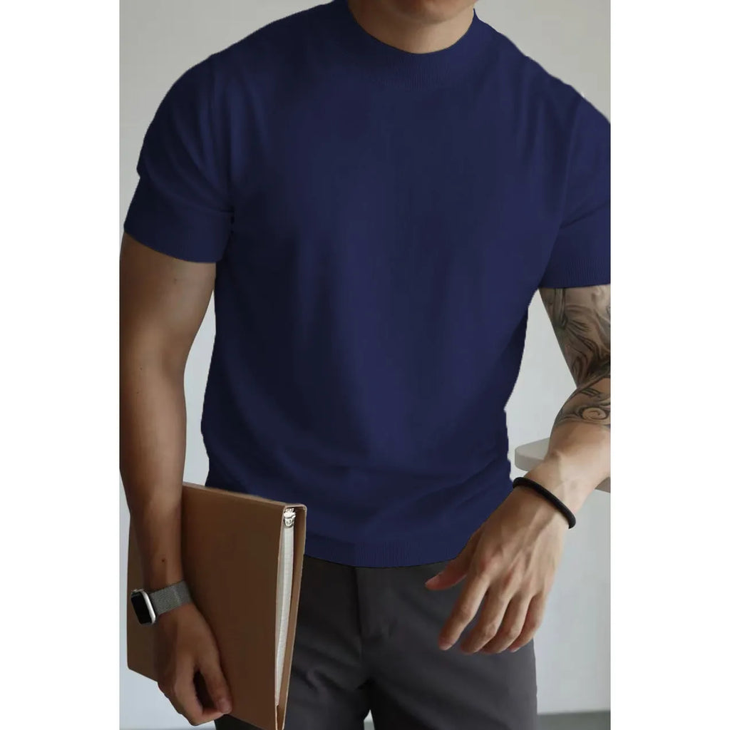 Man wearing a slim-fit solid colour polyester t-shirt, showcasing its lightweight knitwear construction.