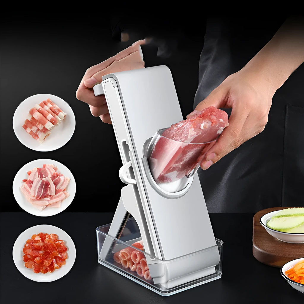 Hand-crank vegetable cutter in simple grey with three blades and fresh-keeping box on a kitchen counter