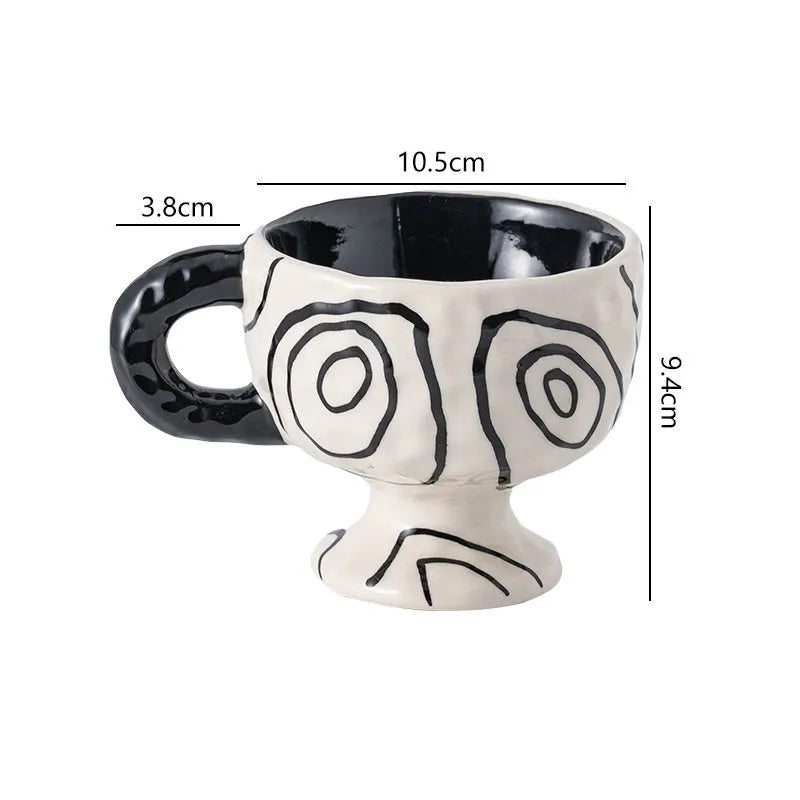 Hand-pinched irregular shaped ceramic mug in solid colour with modern simplicity design