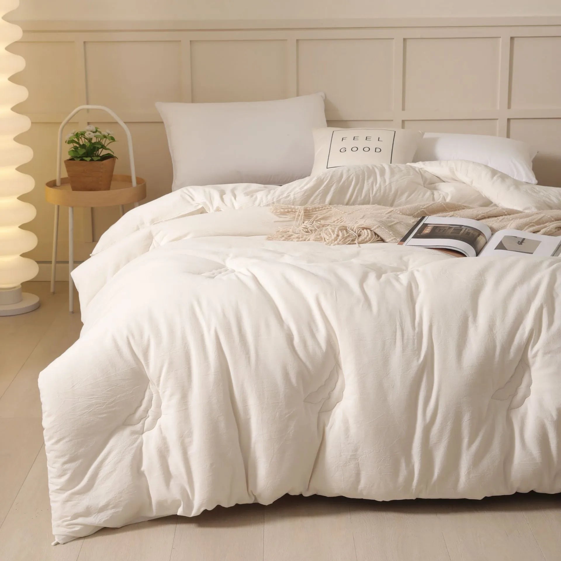 Soybean fibre quilt with pure cotton cover in grey colour on a bed.
