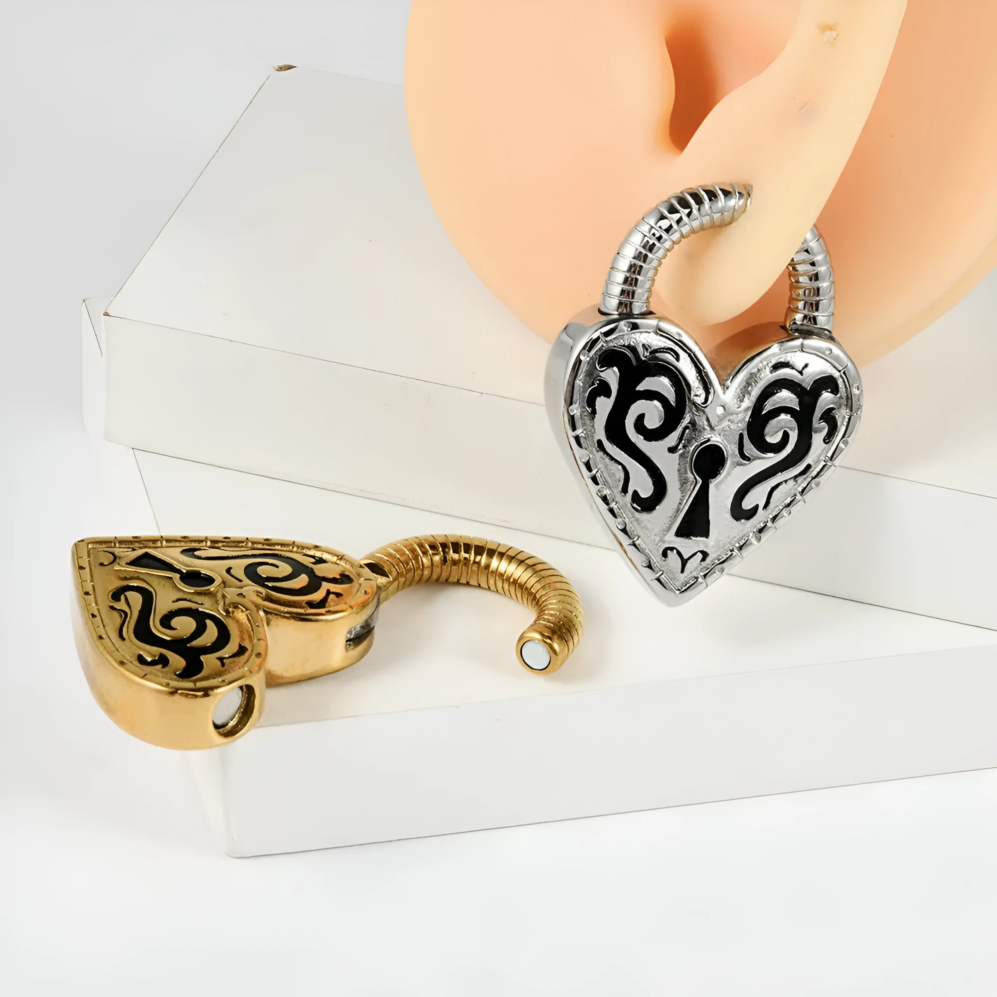 Heart-shaped stainless steel earrings with electroplated gold and steel colour finishes