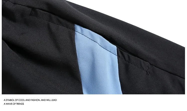 Black and grey quick-drying sports shorts with elastic waistband and loose fit for training