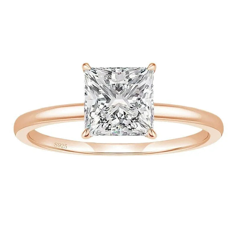 A simple geometric women's ring in polished 925 silver with a round zirconium crystal, shown in silver, gold, and rose gold colour options.