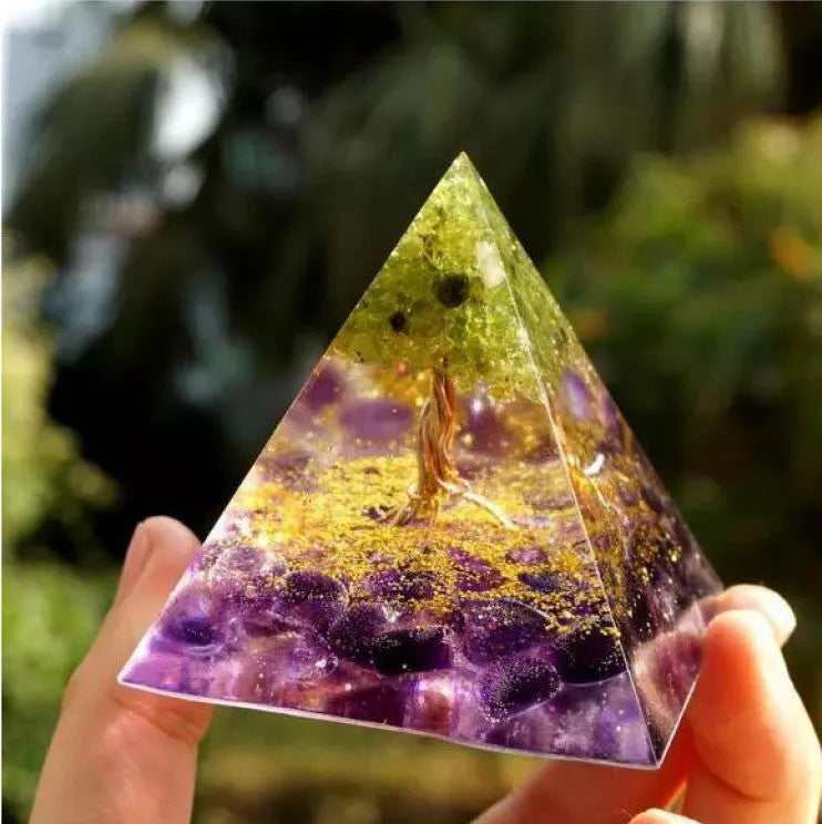Clear epoxy resin pyramid ornament with embedded coloured crystal gravel inside, measuring 6cm.