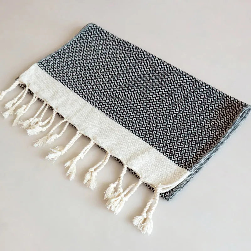Square cotton yarn-dyed napkin with tassel edges in Nordic style, available in multiple colours