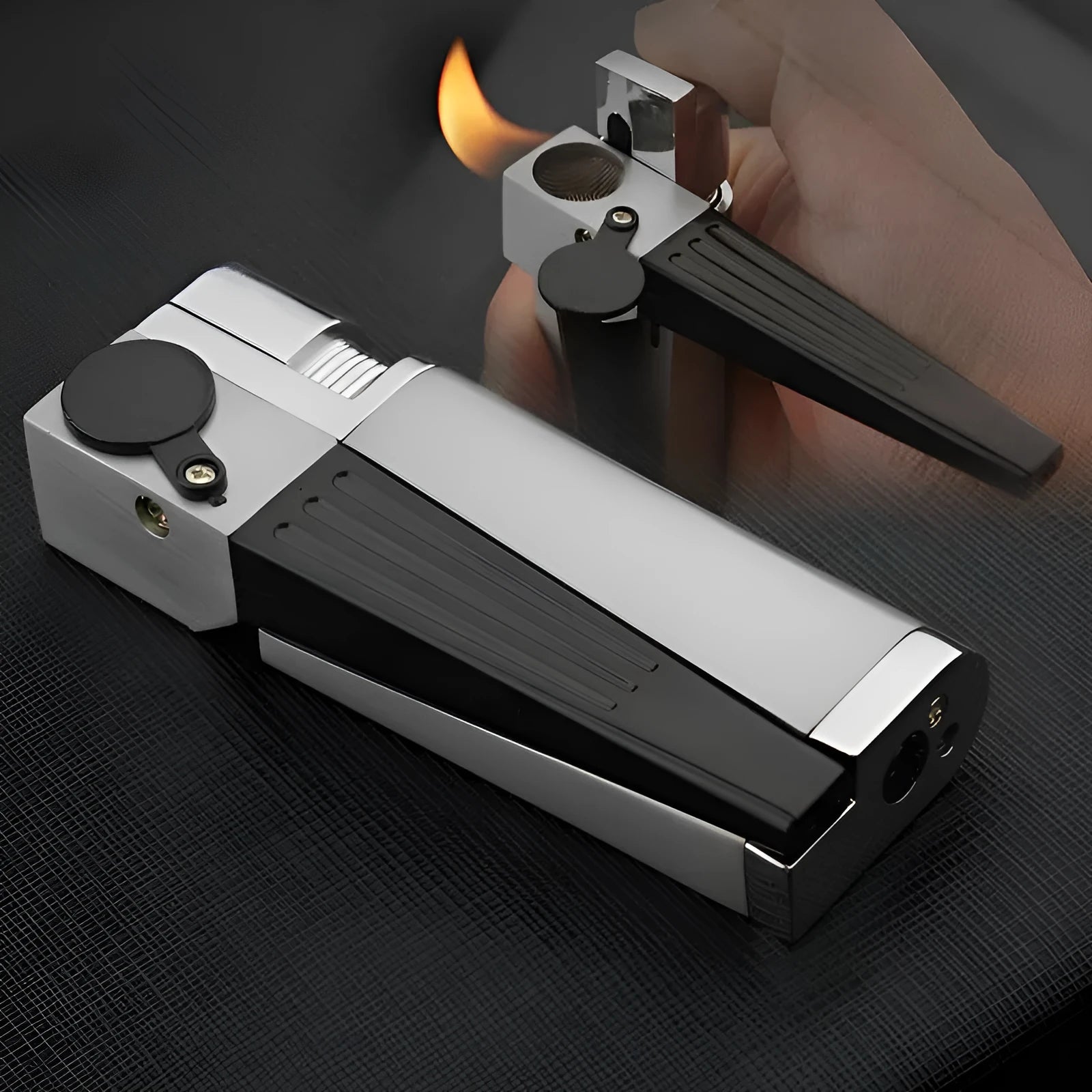 Silver foldable metal pipe lighter shown open, revealing the lighter mechanism and a small stash compartment.