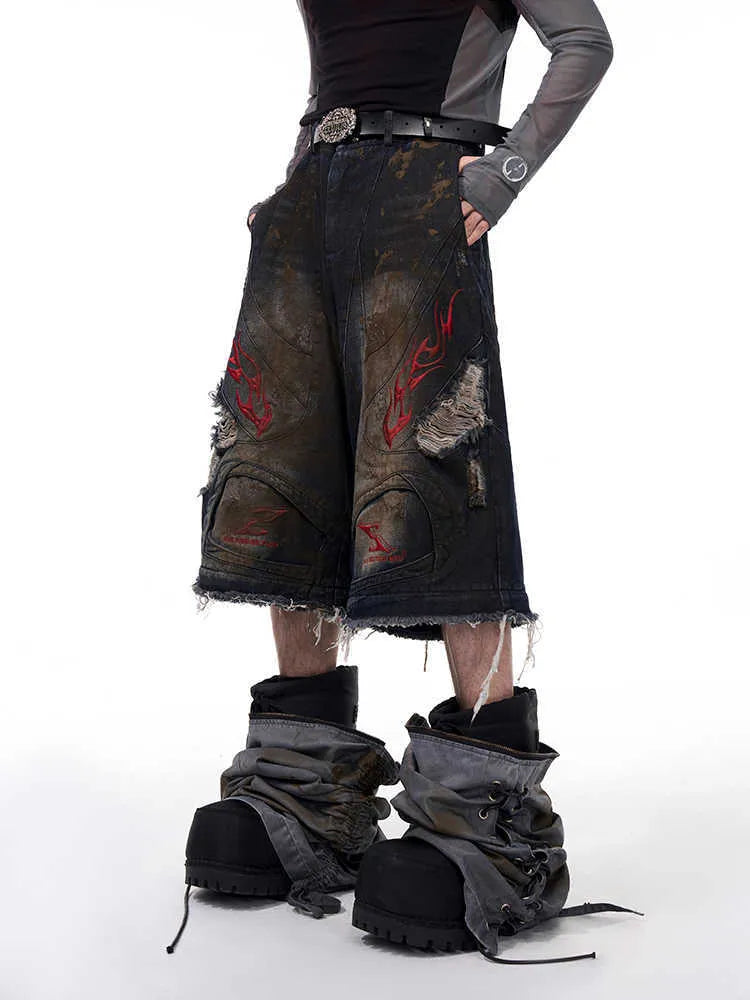 Men's retro jeans with detachable trouser legs showing loose wide-leg fit in picture colour denim