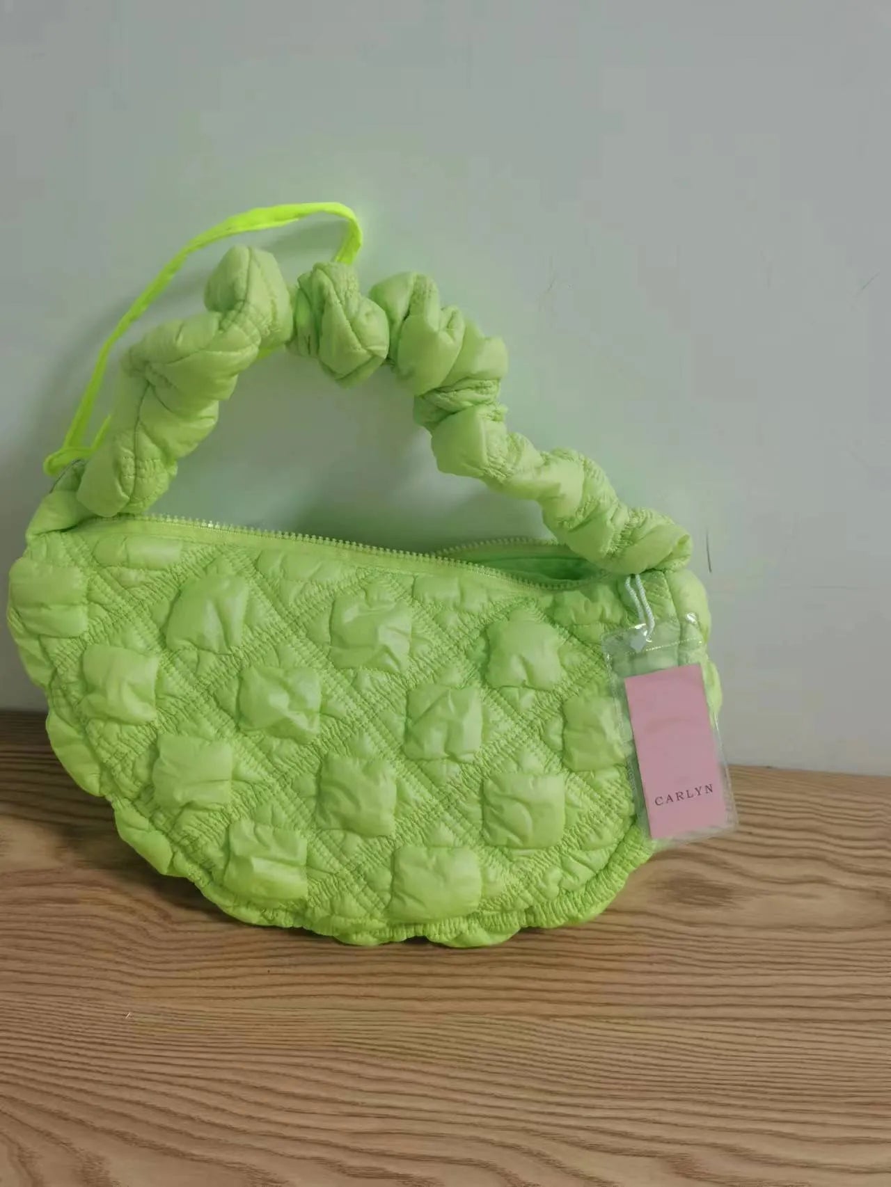 Women's nylon shoulder messenger bag in a solid colour with a long strap, showing front view.