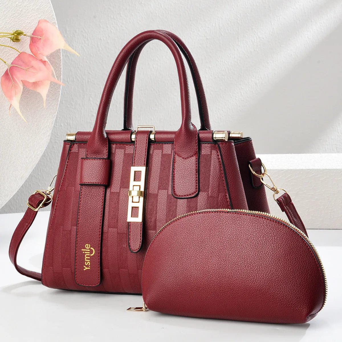 Round PU leather crossbody handbag in light khaki colour showing front view and adjustable shoulder strap.