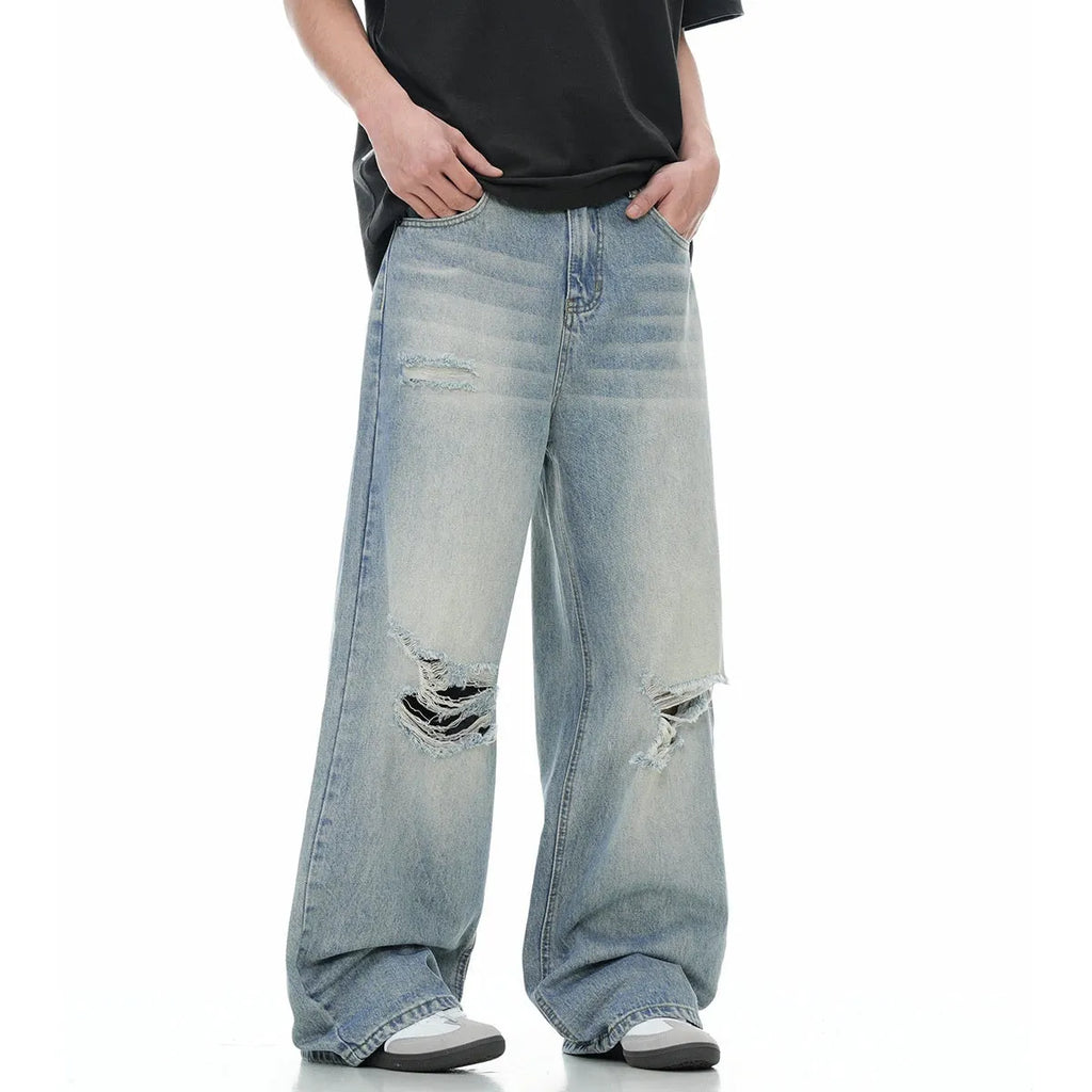 Blue men's straight-leg jeans with ripped knee detailing and a zipper fly
