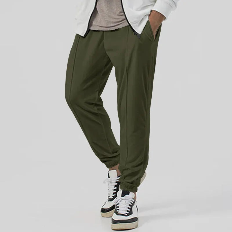 Men's grey track sweatpants with elastic waistband and straight-leg tapered fit