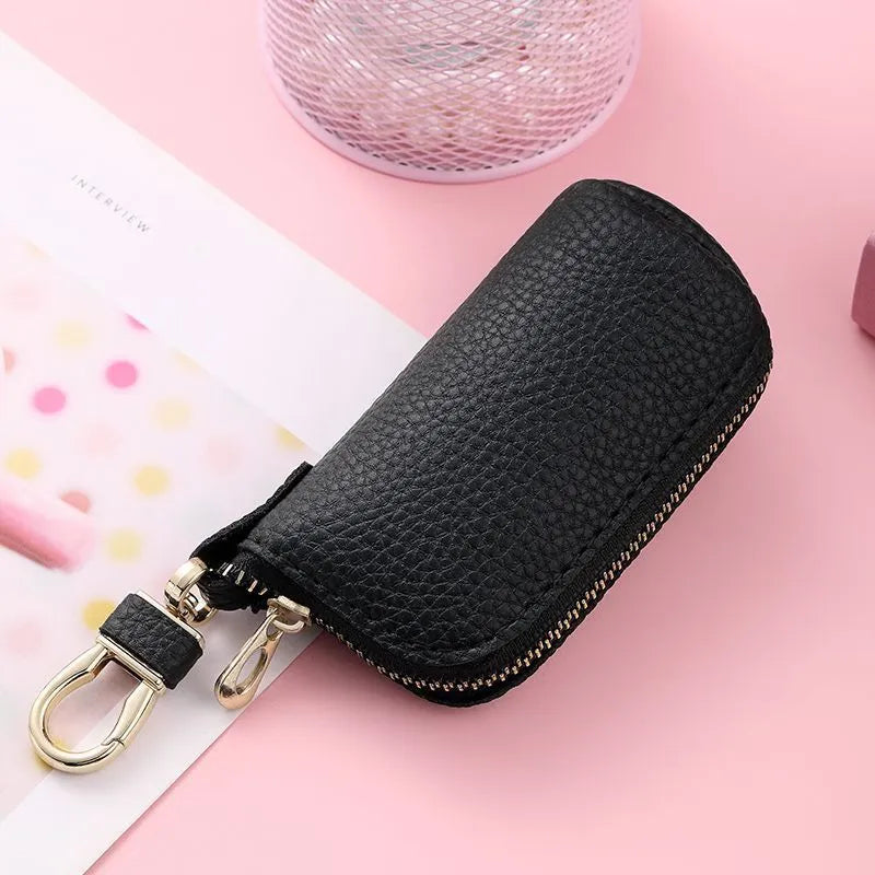 Simple men's zipper key case in black PU leather with minimalist urban design