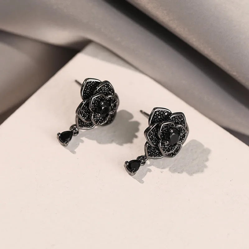 Women's rose gold plated flower ear studs with black zircon stones