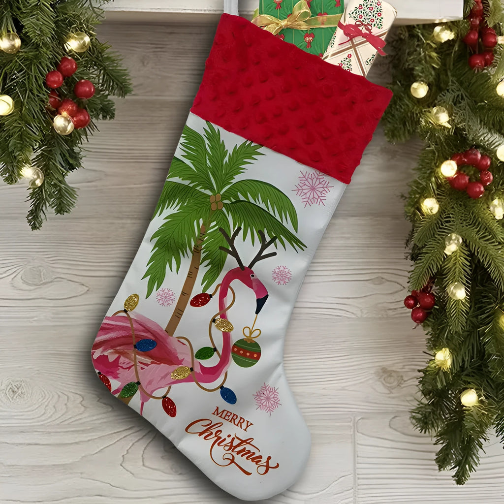 Red cloth Christmas stocking with flamingo design, 46cm long, hanging on fireplace.