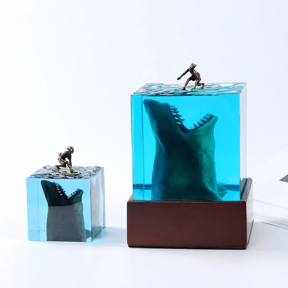 Epoxy resin shark surfer night light ornament with crystal glue details on blue background