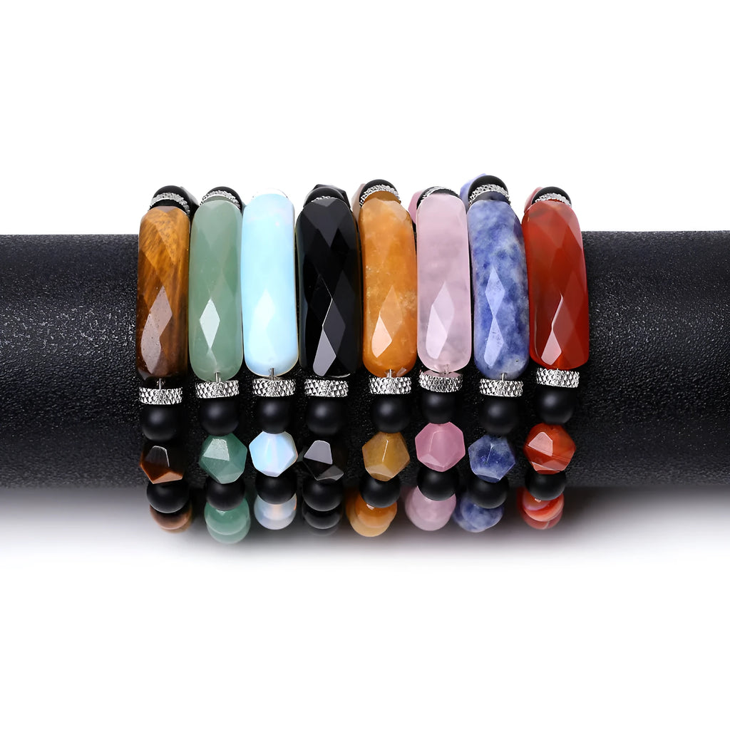 Handmade diamond-shaped cut agate bracelet in a geometric, fan-shaped design on a wrist.