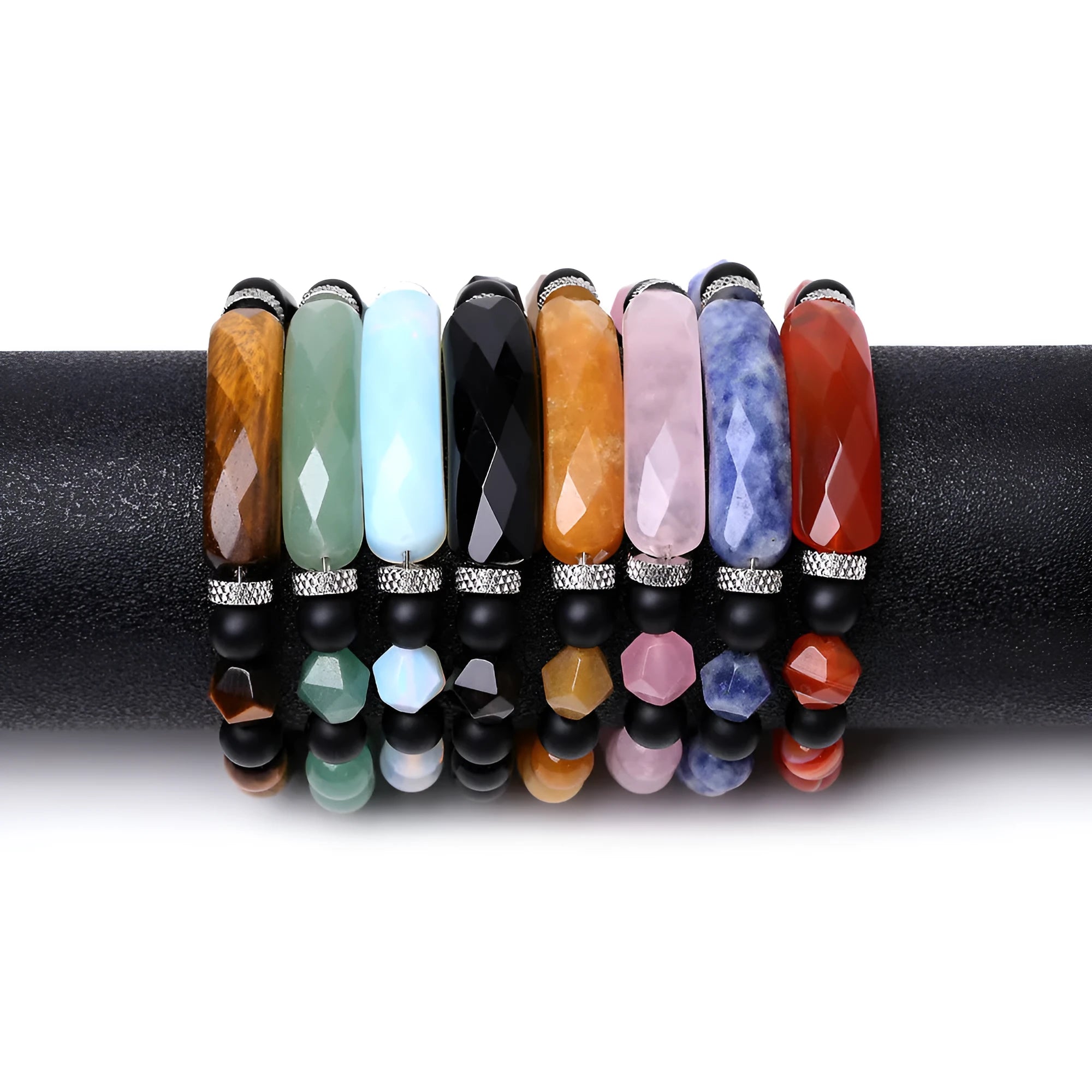 Handmade diamond-shaped cut agate bracelet in a geometric, fan-shaped design on a wrist.