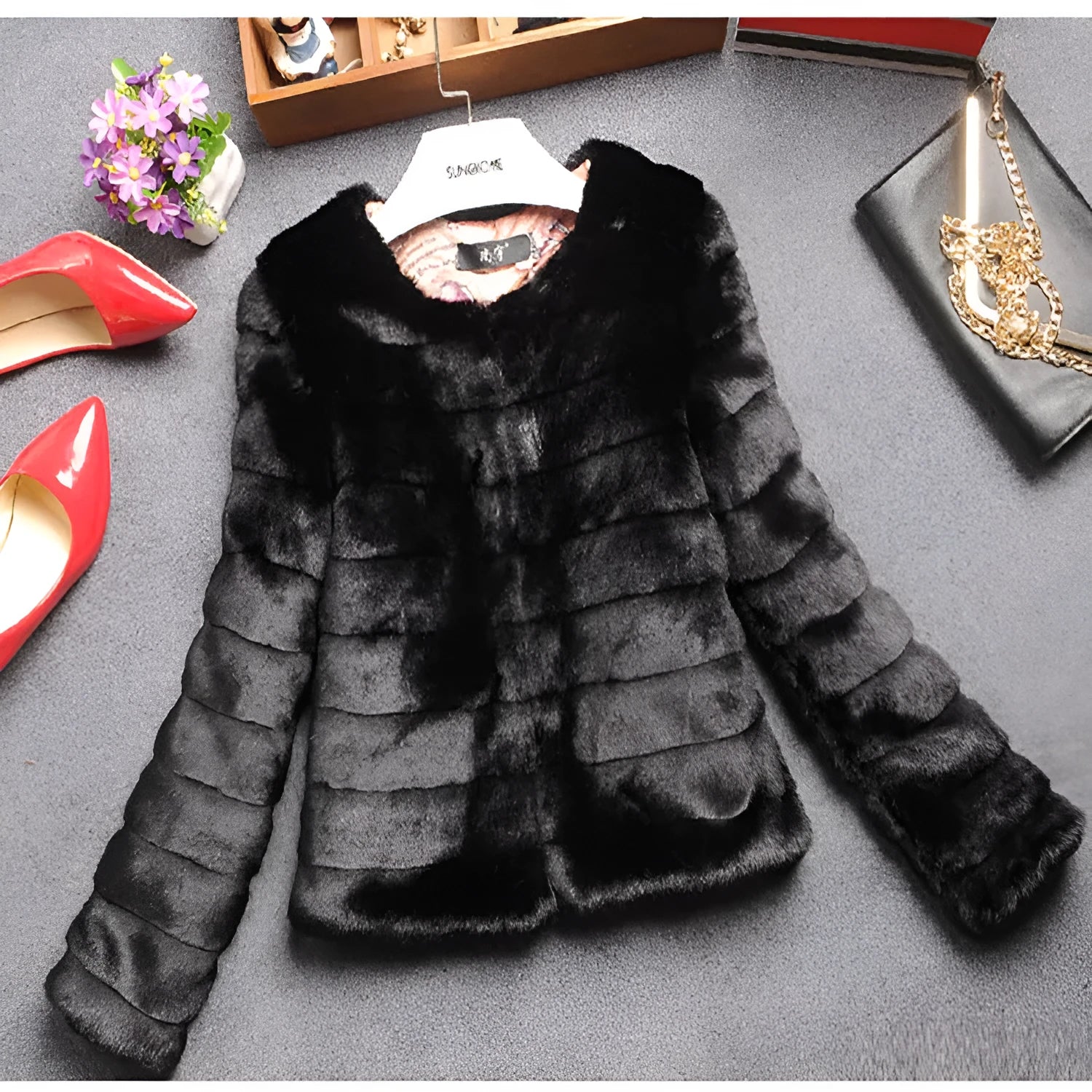 Women's short faux fur top in beige on a model, showing regular sleeves and a cropped 40cm length.