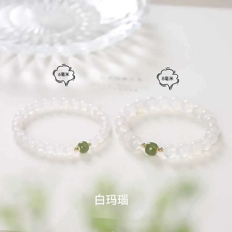 Handmade white agate bracelet with Hetian Jade and Cinnabar inlays showing 6mm and 8mm bead options