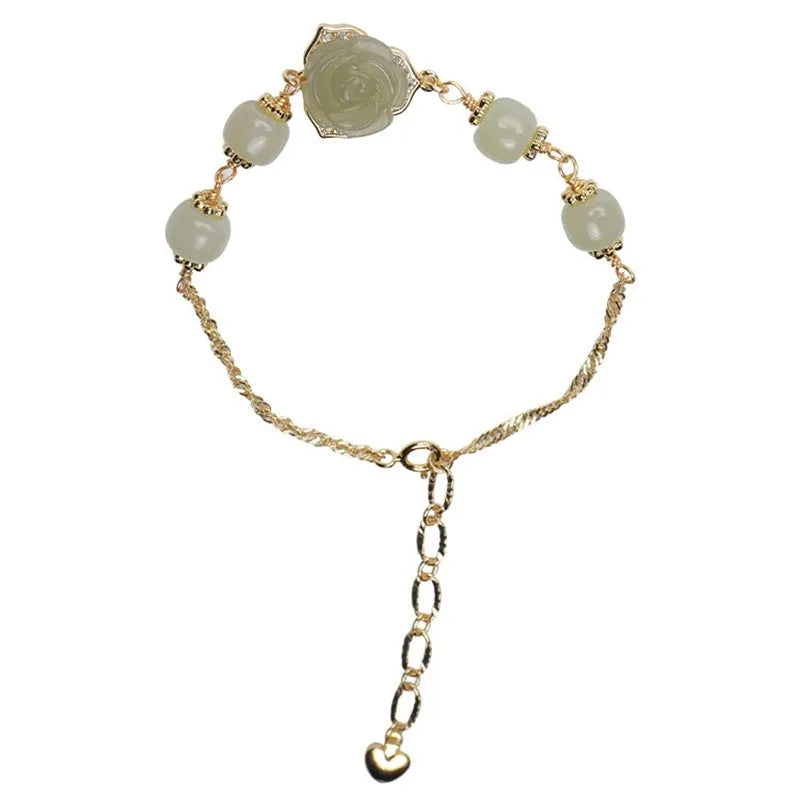 Women's Hetian Jade bracelet with carved rose design and 14K gold gilding on floral-shaped band