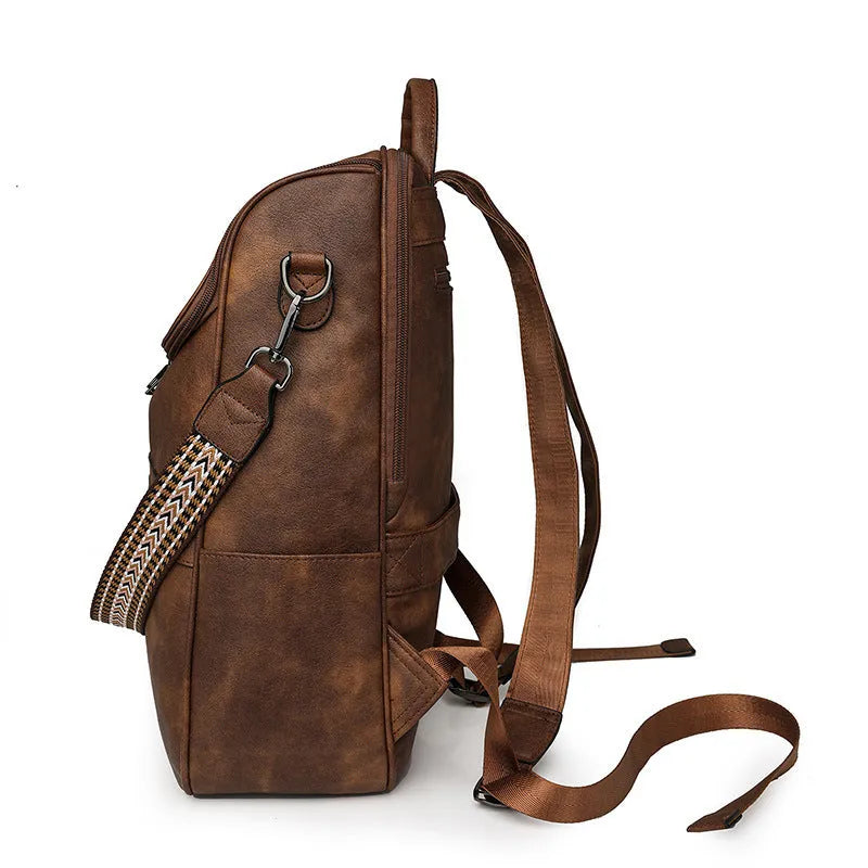 Solid colour retro college backpack with curved shoulder straps, shown in multiple colour options including black and blue.
