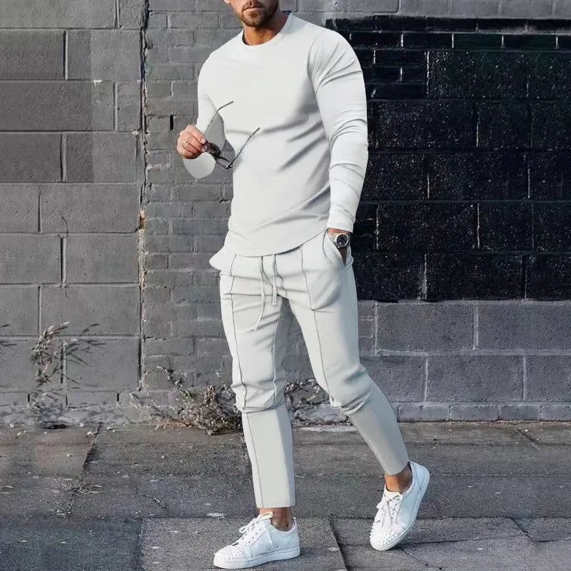 Men's solid colour two-piece polyester tracksuit with long sleeves, shown in apricot colour.