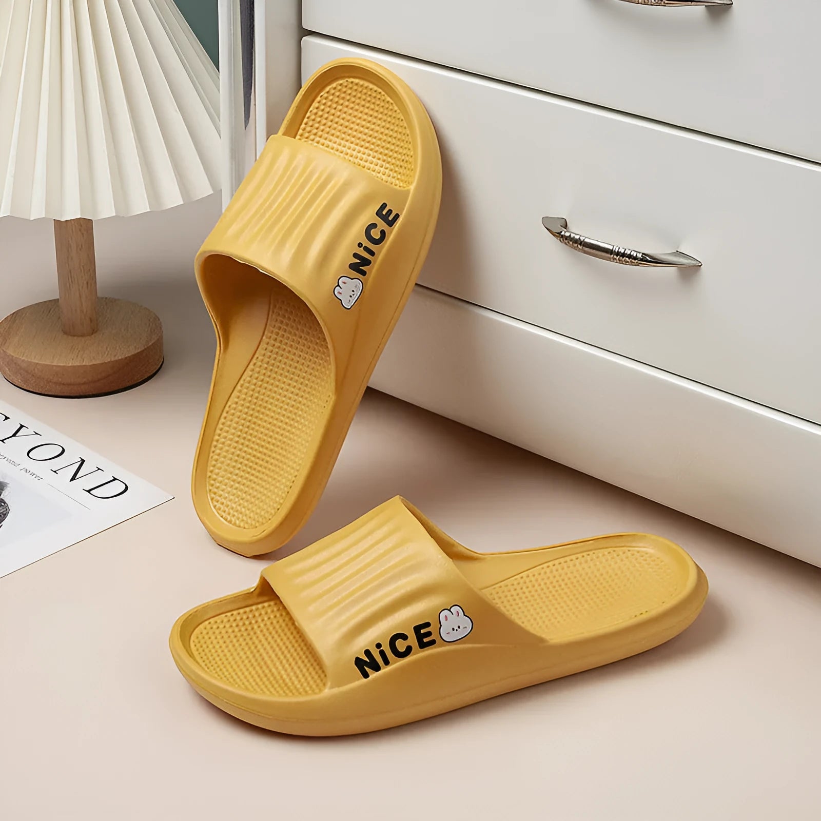 Adult unisex EVA bathroom slippers with cartoon pattern and non-slip sole in multiple colour options