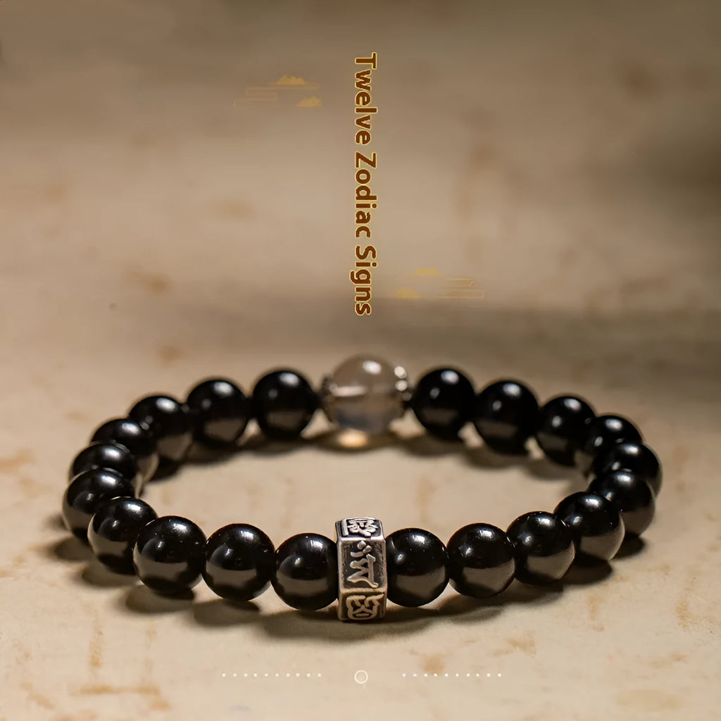 Obsidian zodiac bracelet with 8mm beads showing carved animal and bodhisattva designs in Chinese ethnic style