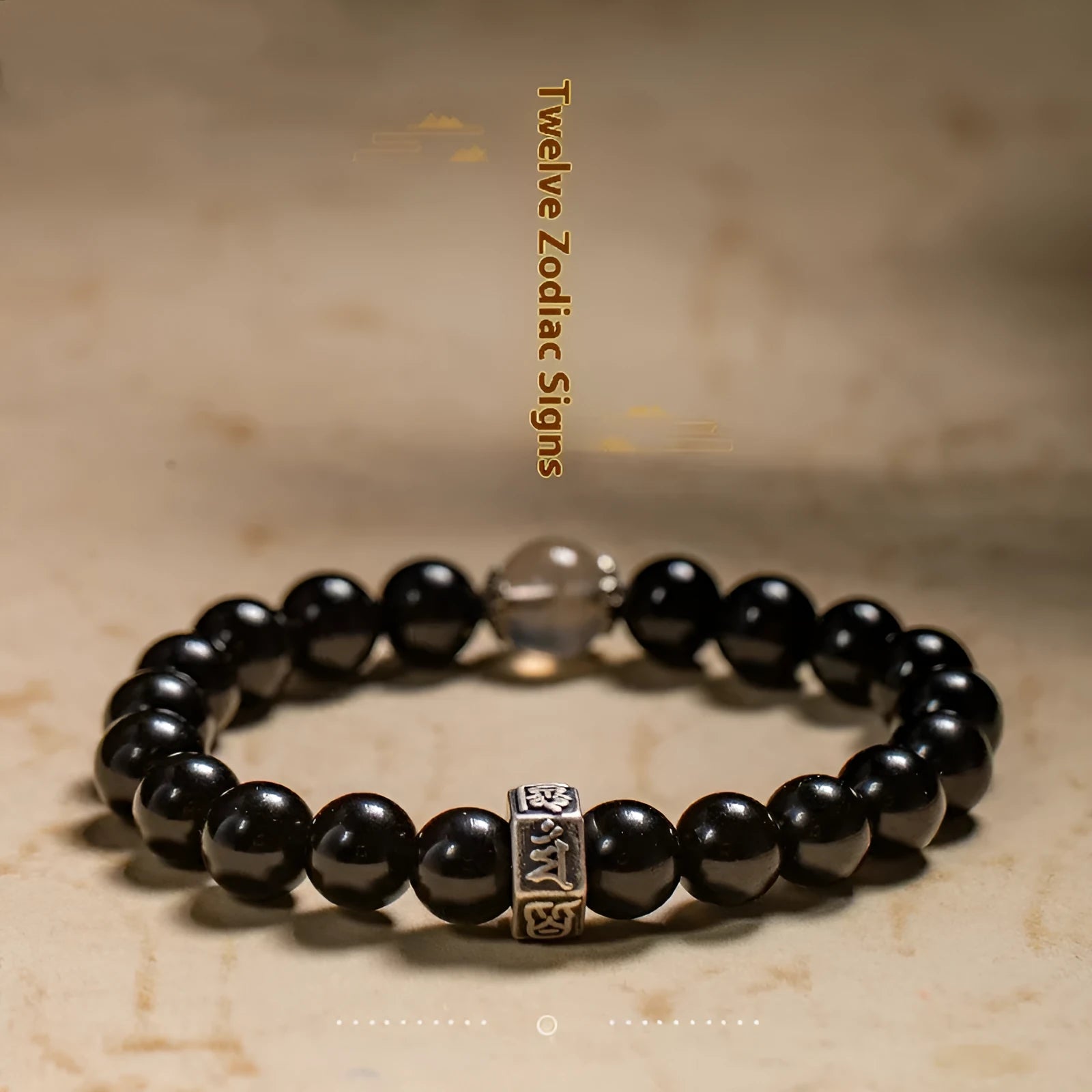 Obsidian zodiac bracelet with 8mm beads showing carved animal and bodhisattva designs in Chinese ethnic style