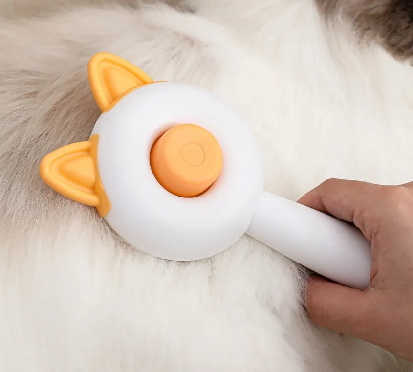 Self-cleaning pet hair remover comb for cats and dogs in greenish white and orange white