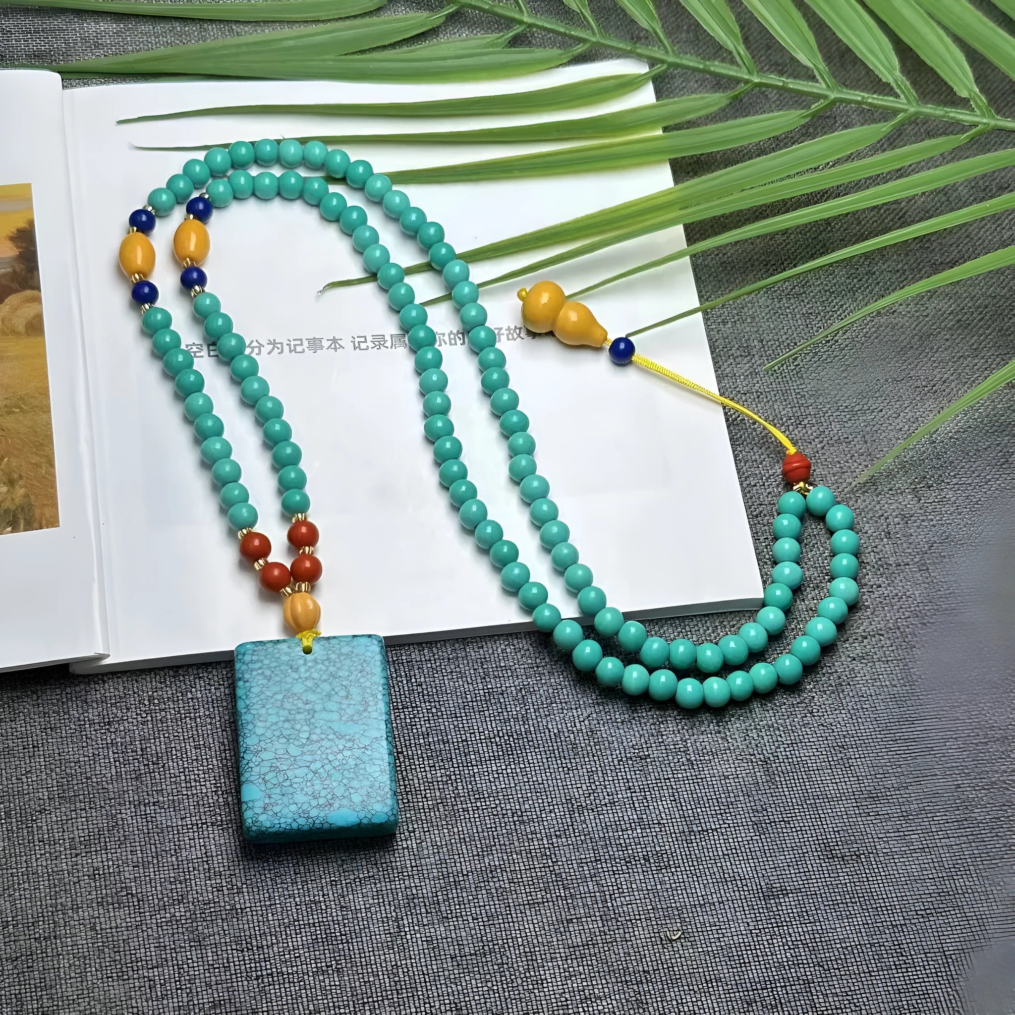 Hand-woven turquoise mesh flower lucky pendant necklace on ball bead chain