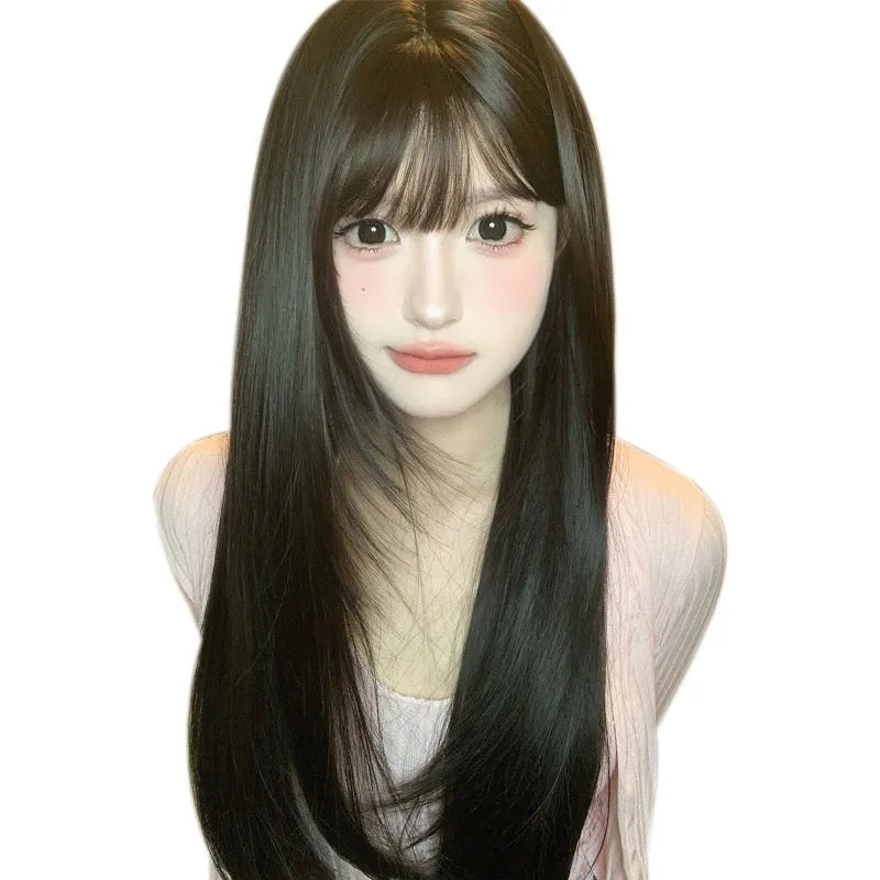 Dark brown long straight synthetic wig with a full fringe on a wig head.