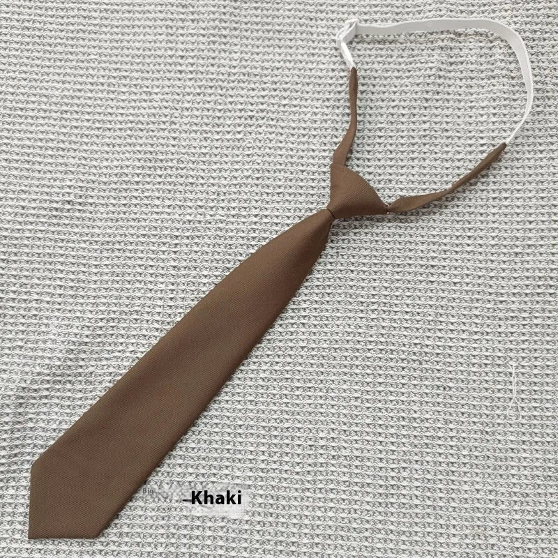 Solid navy blue men's cotton tie with arrow-type design on a white background.