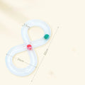 Rotating cat track toy with rolling balls and teasing stick on blue background