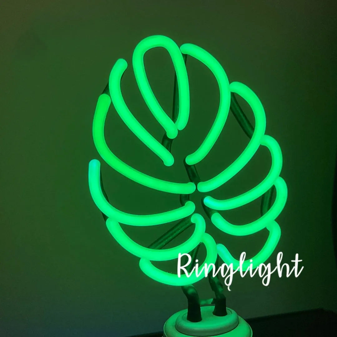 Minimalist bamboo-shaped white and green desktop lamp with USB cable in two size options.