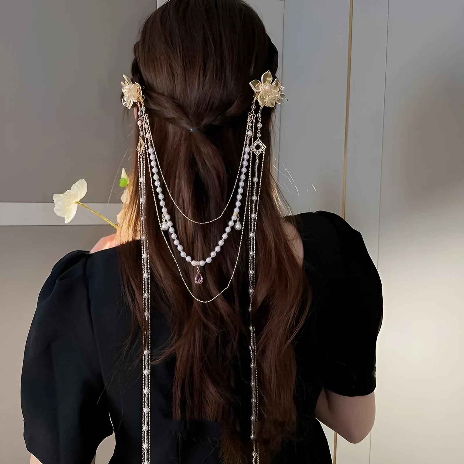 Gold women's hairpin with pearl, diamond acrylic details and a long tassel.