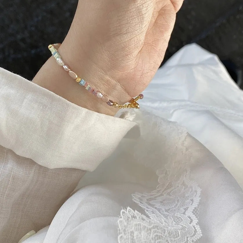 Purple freshwater pearl bracelet and necklace set with 14K gold-plated accents and irregular pearl shapes