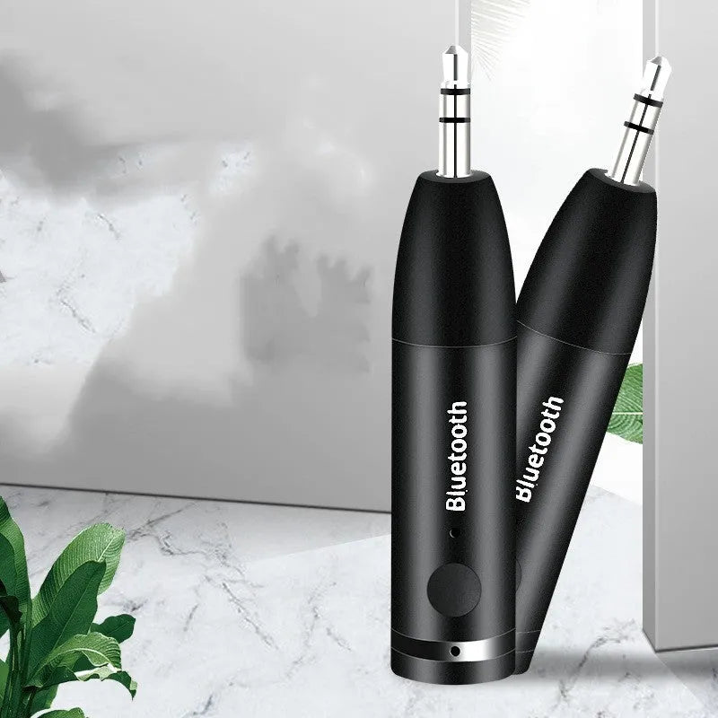 Black Bluetooth car audio receiver with AUX connector for wireless music streaming