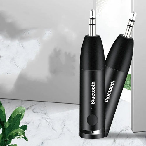 Black Bluetooth car audio receiver with AUX connector for wireless music streaming