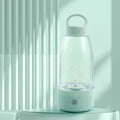 Green automatic electric shaker bottle with USB port, handle, and 380ml capacity.