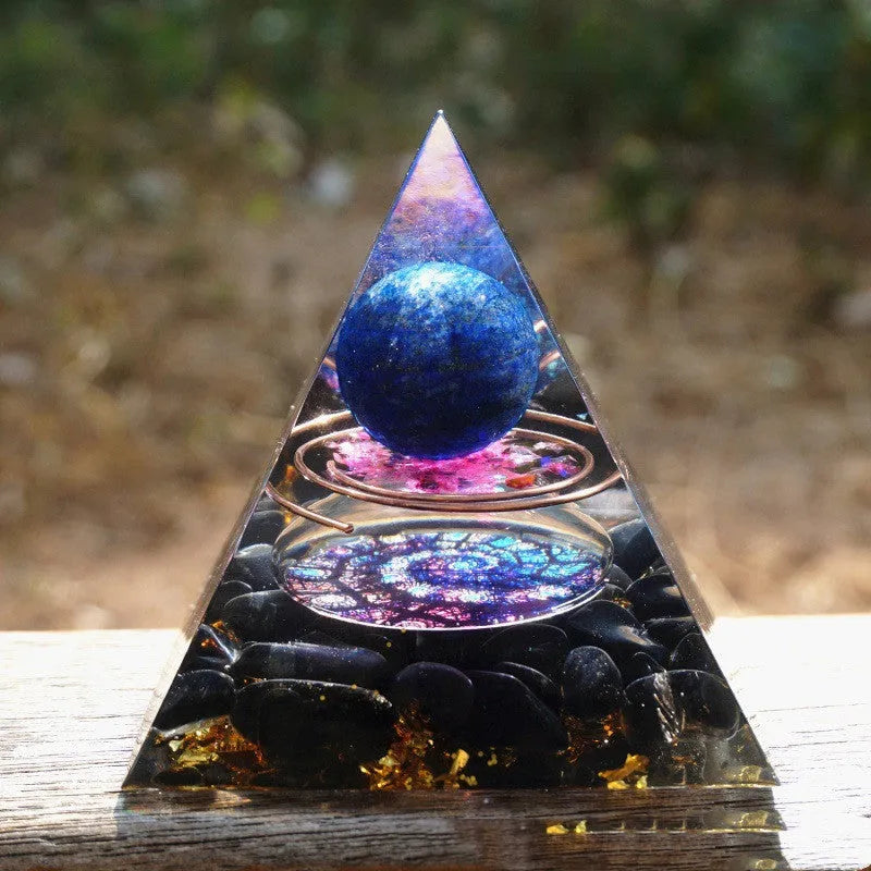 Clear epoxy resin pyramid ornament with embedded coloured crystal gravel inside, measuring 6cm.