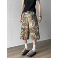 Yellow snake pattern camouflage cotton denim jeans with cropped length and distressed detailing