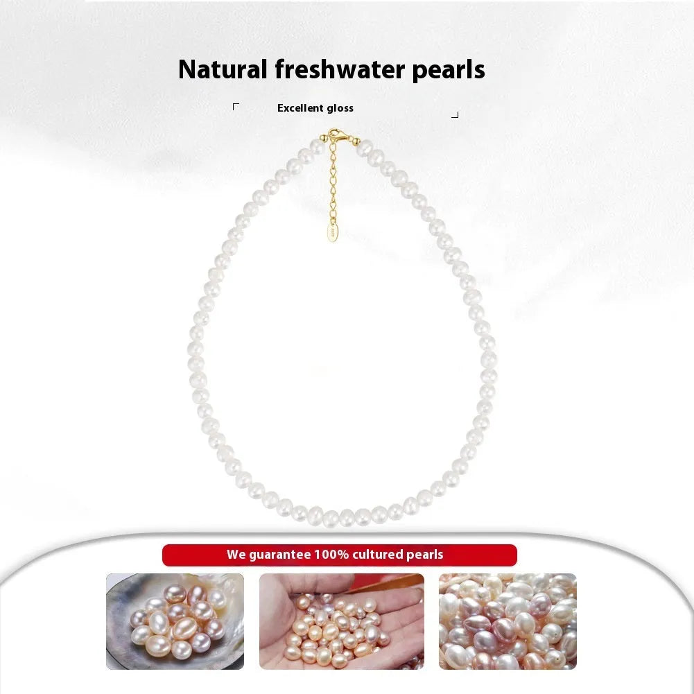 Women's adjustable silver necklace with natural freshwater pearls on a model.