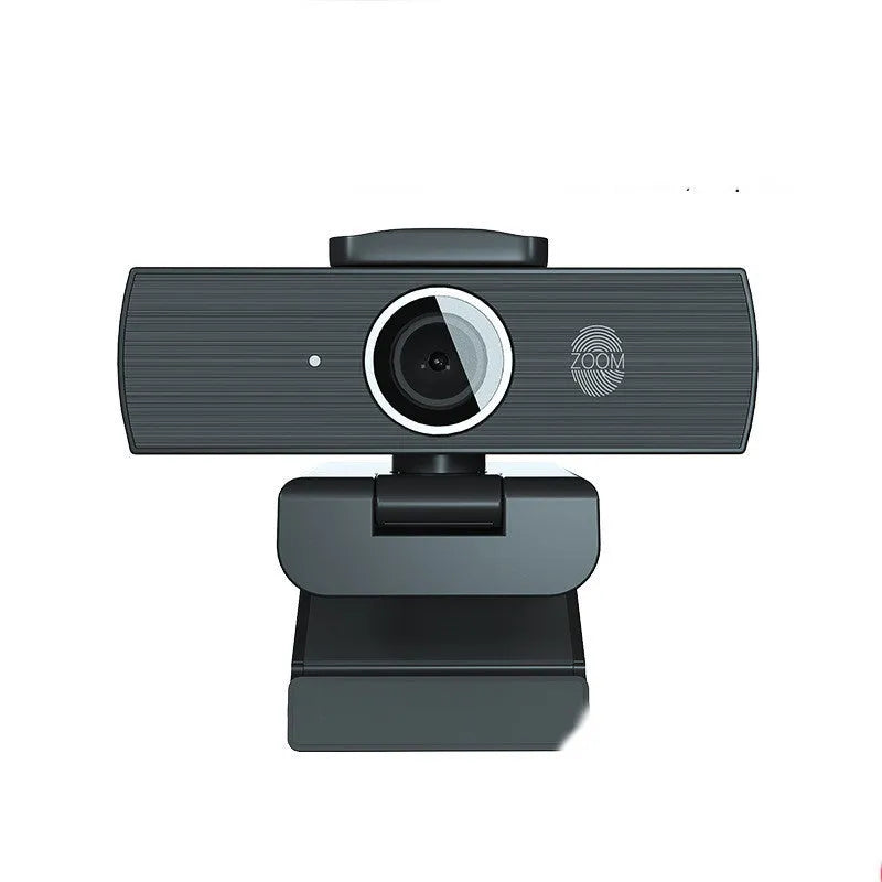 Black USB computer webcam with magnetic privacy cover on a laptop screen