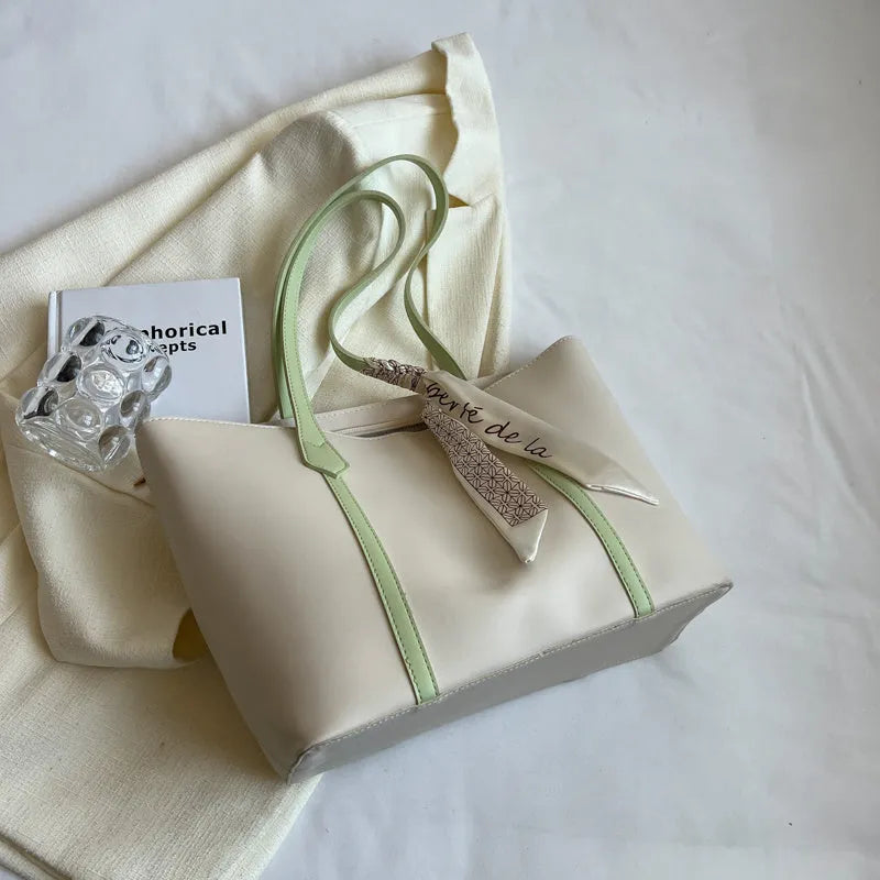 Women's soft large tote bag in a chosen colour, showing outer pockets and sewing detail.